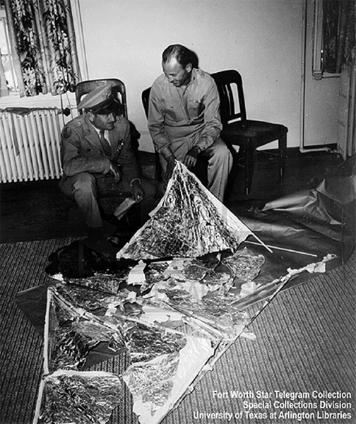 General Roger M. Ramey, with chief of staff Colonel Thomas DuBose in Ramey’s office with the weather balloon (8 July 1947)